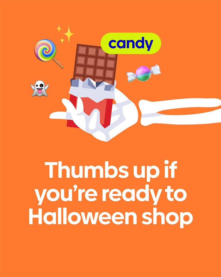 A skeleton hand holding a candy bar.